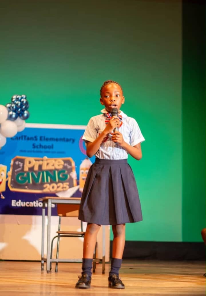CarlTanS pupil giving a speech on stage at Prize Giving 2025